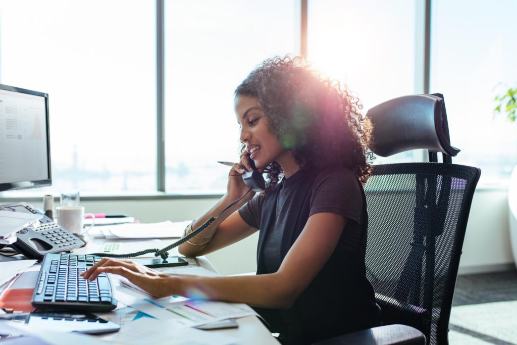 African American woman works on desktop