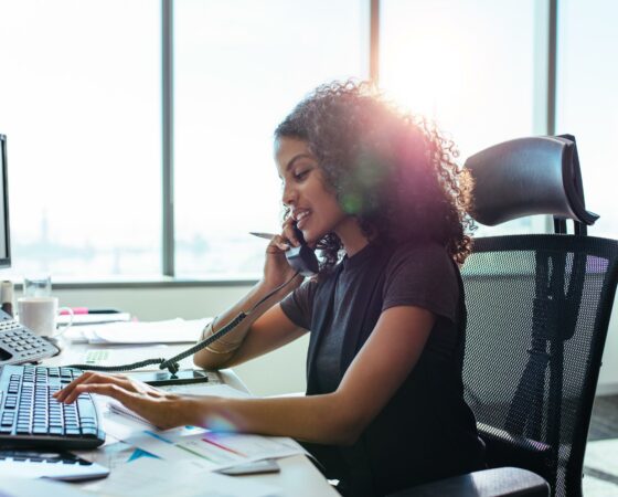 African American woman works on desktop