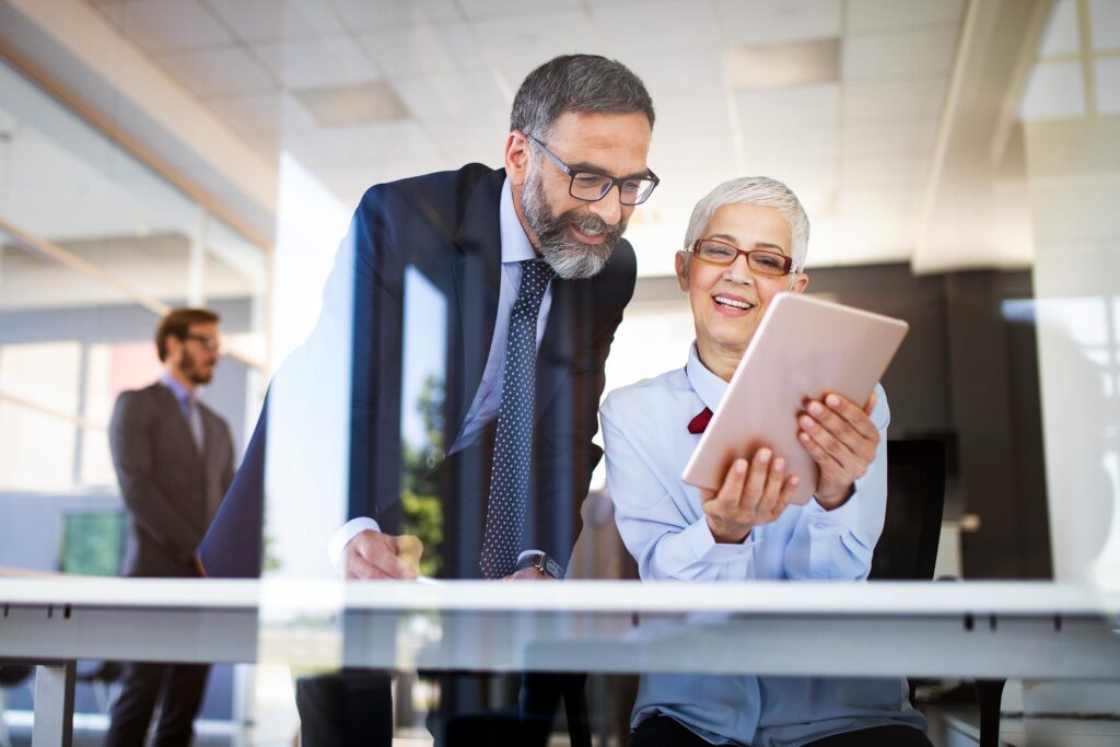 Business-coworkers-using-tablet-in-office