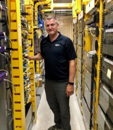 Man standing in networking room